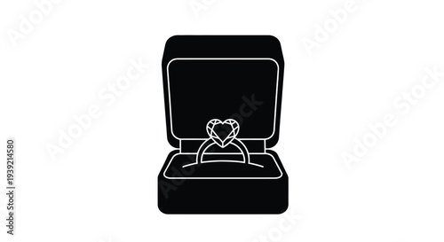 Open jewelry box displaying a heart shaped diamond ring silhouette