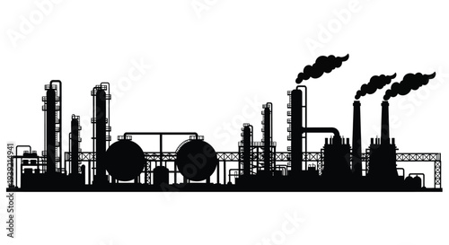Industrial complex with towers and smokestacks against a bright background silhouette