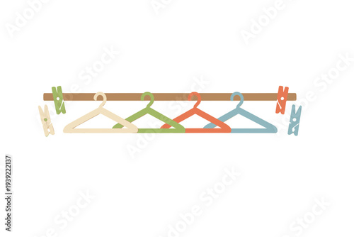 Four colorful clothes hangers in cream, green, orange, and blue hang from a brown horizontal bar alongside matching clothespins against a solid black background.