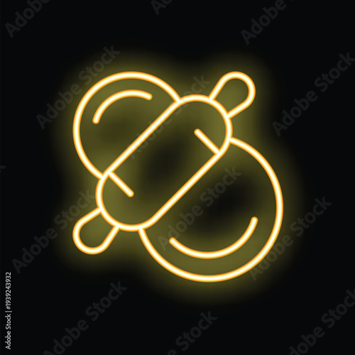 Yellow glowing neon sign representing a rolling pin placed on dough, evoking cooking and baking