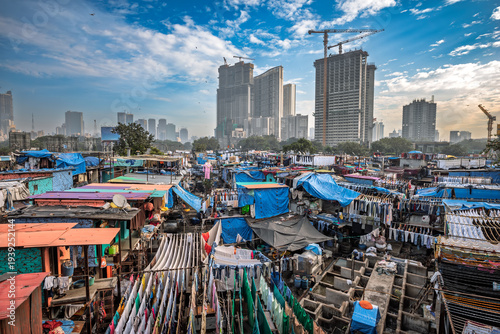 Contrast of Mumbai skyscrapers and Dhobi Ghat laundry.