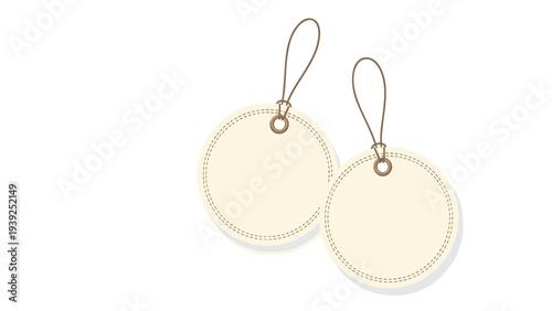 Two blank round cream-colored price tags with stitched edges and brown string loops, ready for custom text or pricing information.