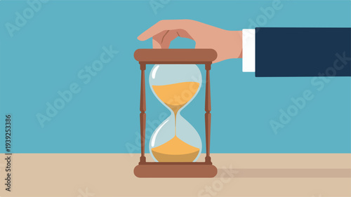 A hand turning an hourglass on a table, symbolizing patience and time management in a business setting