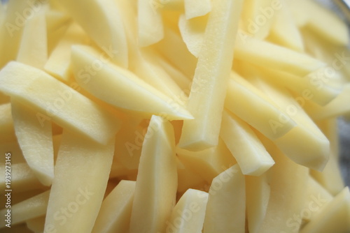 hand cut fries in a bowl with water 