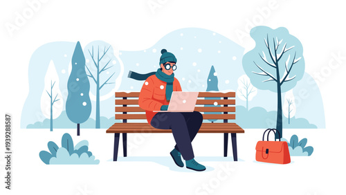 Young man in warm winter attire sits on a park bench, diligently working on his laptop amidst a serene snowy park with trees and a bag beside him.