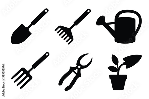 Black silhouettes of gardening tools and plant shovel
