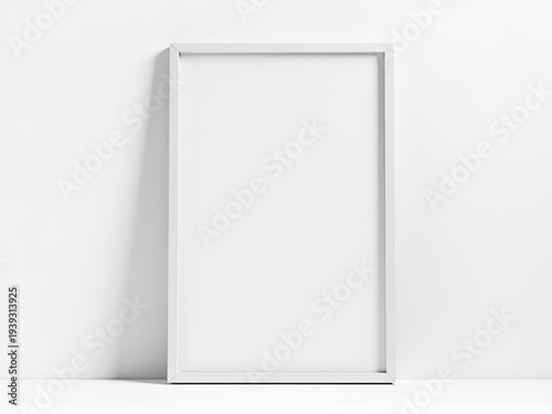 A picture frame leans against a white wall, ready to hold a treasured memory