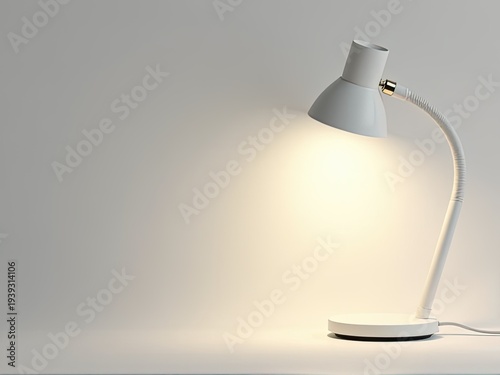 A simple white desk lamp sits on a table, providing a clean and minimalist lighting solution
