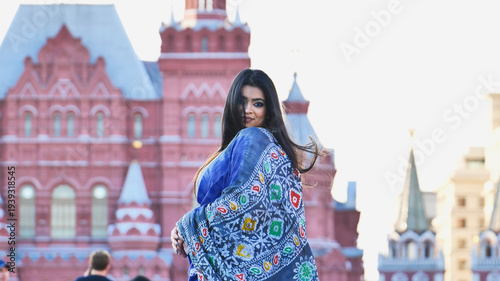 Young Bangladeshi woman traveling in Moscow, exploring historical architecture