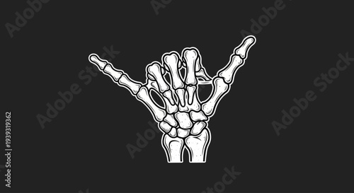 A skeleton hand making the rock on sign with fingers isolated on black