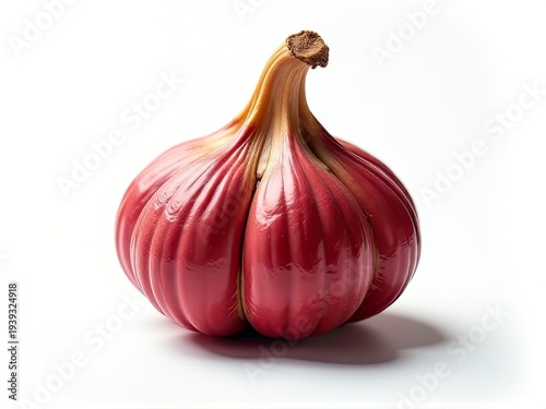 A close-up shot of a red onion on a white surface, great for food and kitchen-related uses