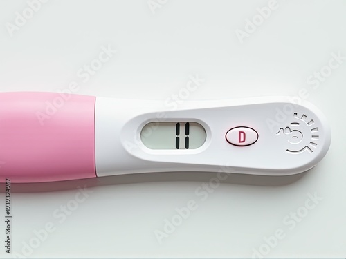 A pink and white electronic thermometer on a white surface