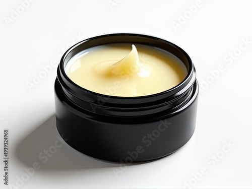 A jar of cream sitting on a table