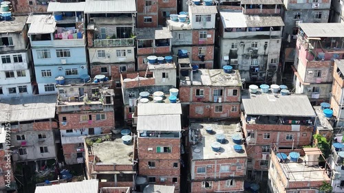 Aerial drone view of Favela Of Cantagalo, Rocinha favelas spread out on the mountain in Sao Conrado , Rio de Janeiro, Brazil.