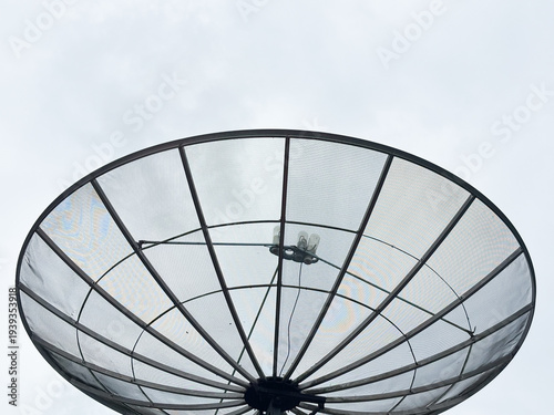 Large Mesh Satellite Dish Antenna Against a Clear Sky Background for Telecommunication and Broadcasting