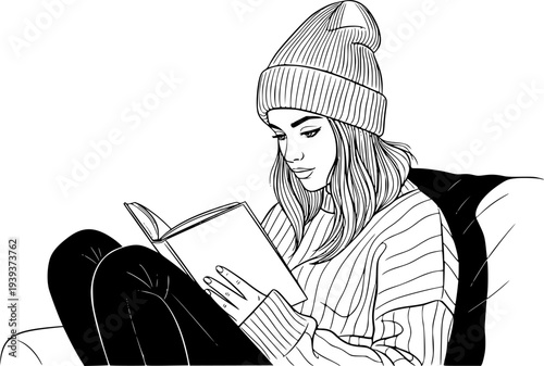Young woman wearing a beanie and cozy sweater sitting comfortably while reading a book