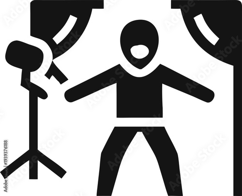 Person standing in a professional photo studio environment with softbox lighting equipment for a photoshoot session