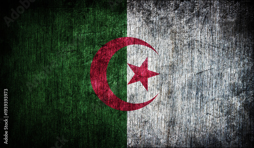 Abstract retro flag of Algeria on a wooden background.