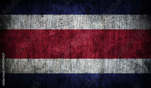 Abstract retro Costa Rica flag on wooden background.