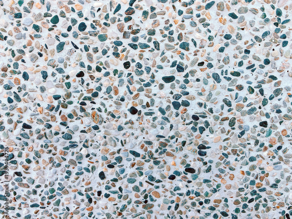 Fototapeta premium Close-up of a wall covered in various pebbles