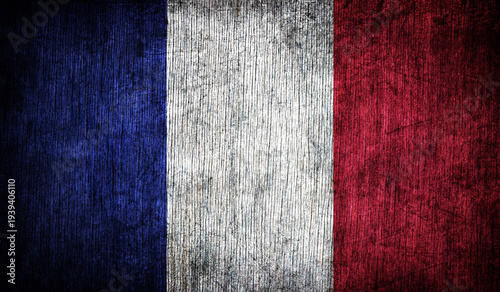 Abstract retro flag of France on a wooden background.