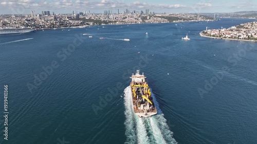 A giant ship is passing through Istanbul; aerial footage. Drone footage of the ship in the Istanbul Strait.