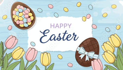 Happy Easter greeting with chocolate eggs, colorful candies, and pink and yellow tulips on a rustic light blue wooden background