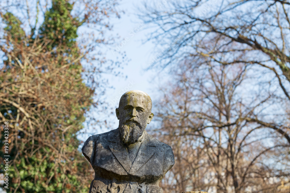 Fototapeta premium Historic Statue on the winter mystery old Prague Cemetery, Czech Republic