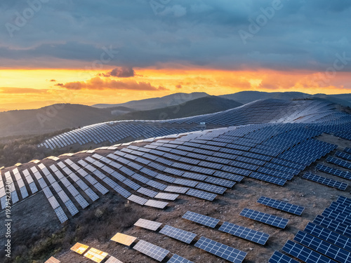 Wallpaper Mural Aerial view of solar farm on mountain slopes at dusk Torontodigital.ca