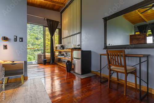 Fotografie Modern cabin bedroom with forest view and balcony