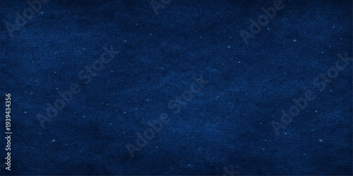 A dark blue grunge denim fabric texture background with vintage star patterns on a rough canvas material for an abstract textured wallpaper design