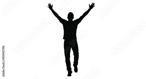 A joyful person with arms raised in celebration dark silhouette