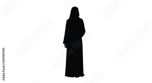 A solitary woman stands in traditional dress a striking silhouette