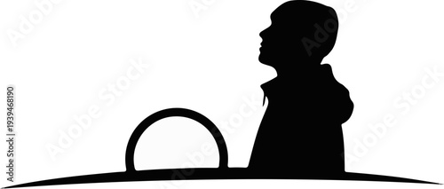 Silhouette of person at steering wheel, looking up