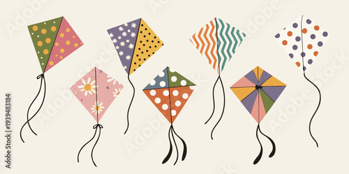 A collection of colorful patterned kites floating against a neutral background