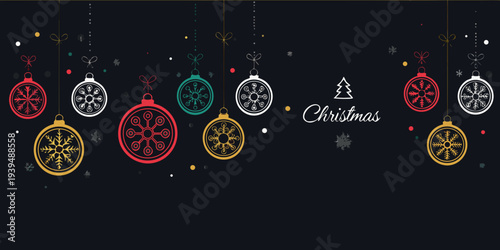 Festive christmas ornaments and calligraphy on a dark background
