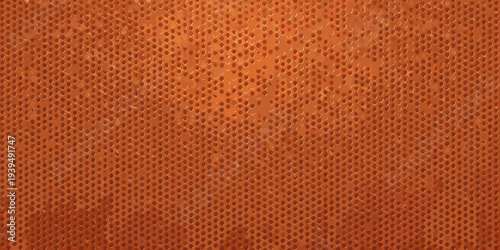 Close up of a basketball s textured surface in vibrant orange hues