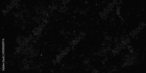Abstract dark texture with scattered bright specks resembling stars