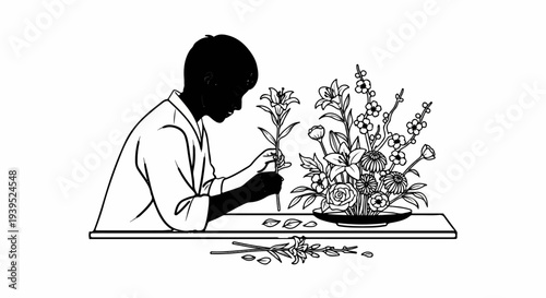 A person arranges flowers on a table, creating a beautiful floral display