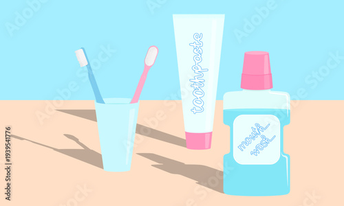 A set of two toothbrushes in a glass, a tube of toothpaste, and mouthwash