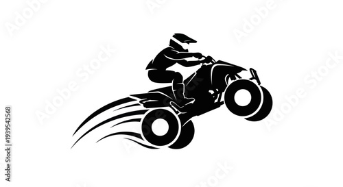 Quad bike rider silhouette performing a jump with motion trails