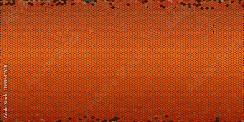 Overhead view of a tightly packed textured orange honeycomb pattern