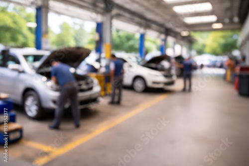 Blurred Auto Repair Shop Interior with Mechanics