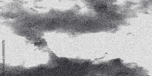 Abstract grayscale clouds with granular texture creating a moody and atmospheric background for artistic and design purposes