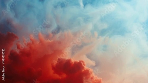 Dramatic abstract sky with vibrant red and blue smoke-like clouds creating a dynamic and colorful atmospheric scene.