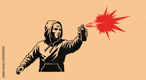 Man in Hoodie Holding Spray Paint Can.