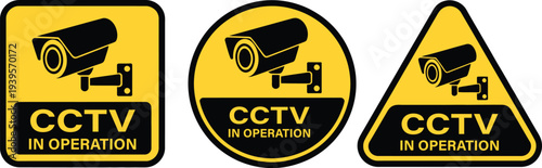 Three C T V in operation warning signs yellow and black