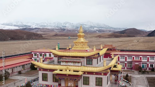 Wallpaper Mural Golden Tibetan Temple in Ganzi with Snow-Capped Mountains Aerial View Torontodigital.ca