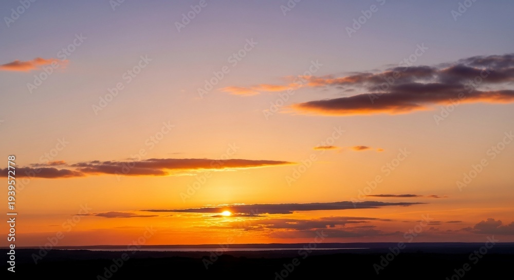 Obraz premium Serene Sunset Landscape with Orange Clouds.
