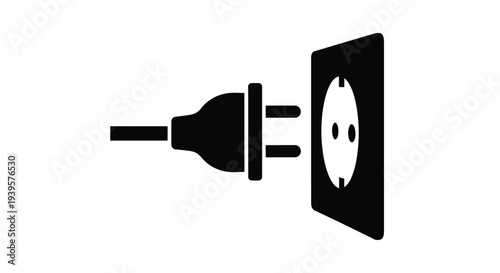 Black plug inserted into a white electrical outlet a stark silhouette